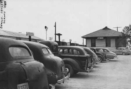 Image of T&P Stations & Structures in Odessa TX parking lot c1949
