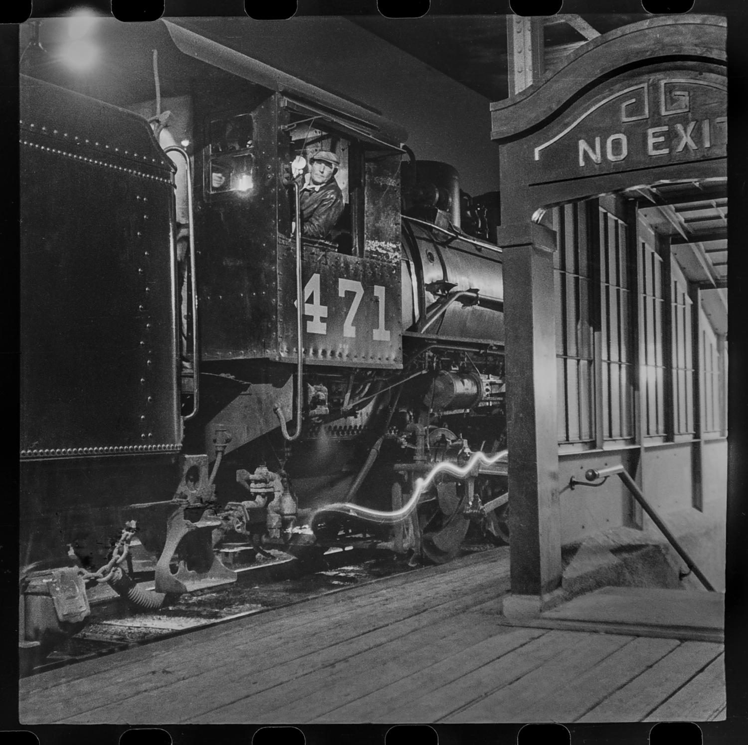 T&P conductor at the station at night