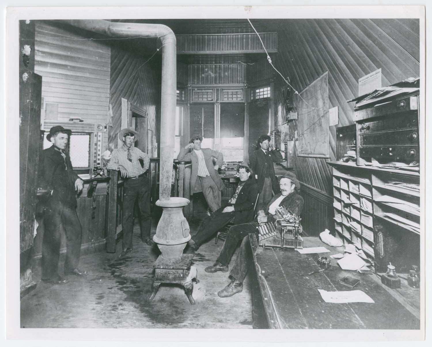 Men Inside the Texas and Pacific Railway Depot