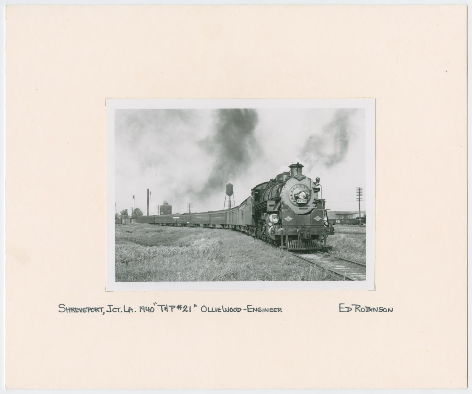 Train Engine #700 and Cars on Tracks