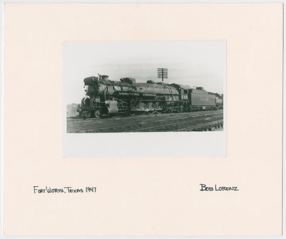 Train Engine #668 and Cars on Tracks