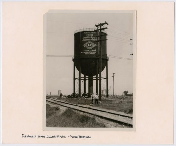 Small Group of Homeless Underneath a T&P Water Tower