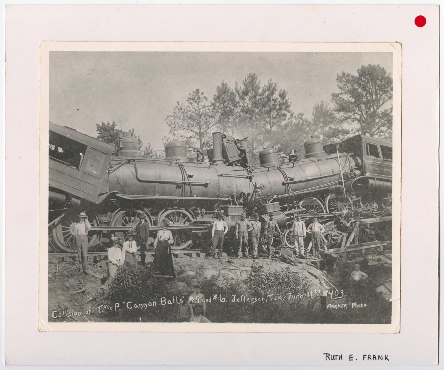 Group Photo Posing in Front of a Train Wreck